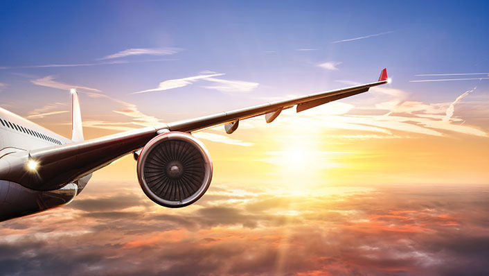 Airoplane flying during sunset